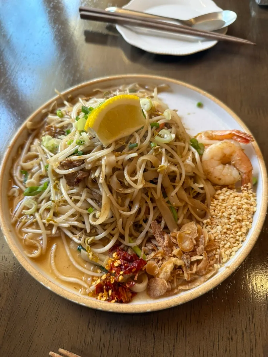 Thai Yami's pad thai topped with shrimp and bean sprouts