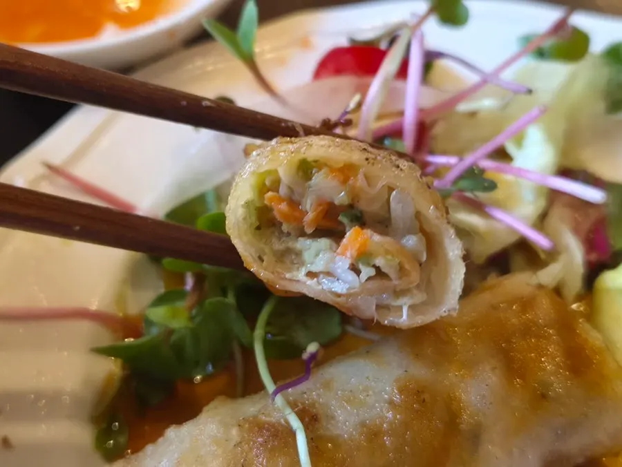 Jjajo spring roll cut in half showing the filling