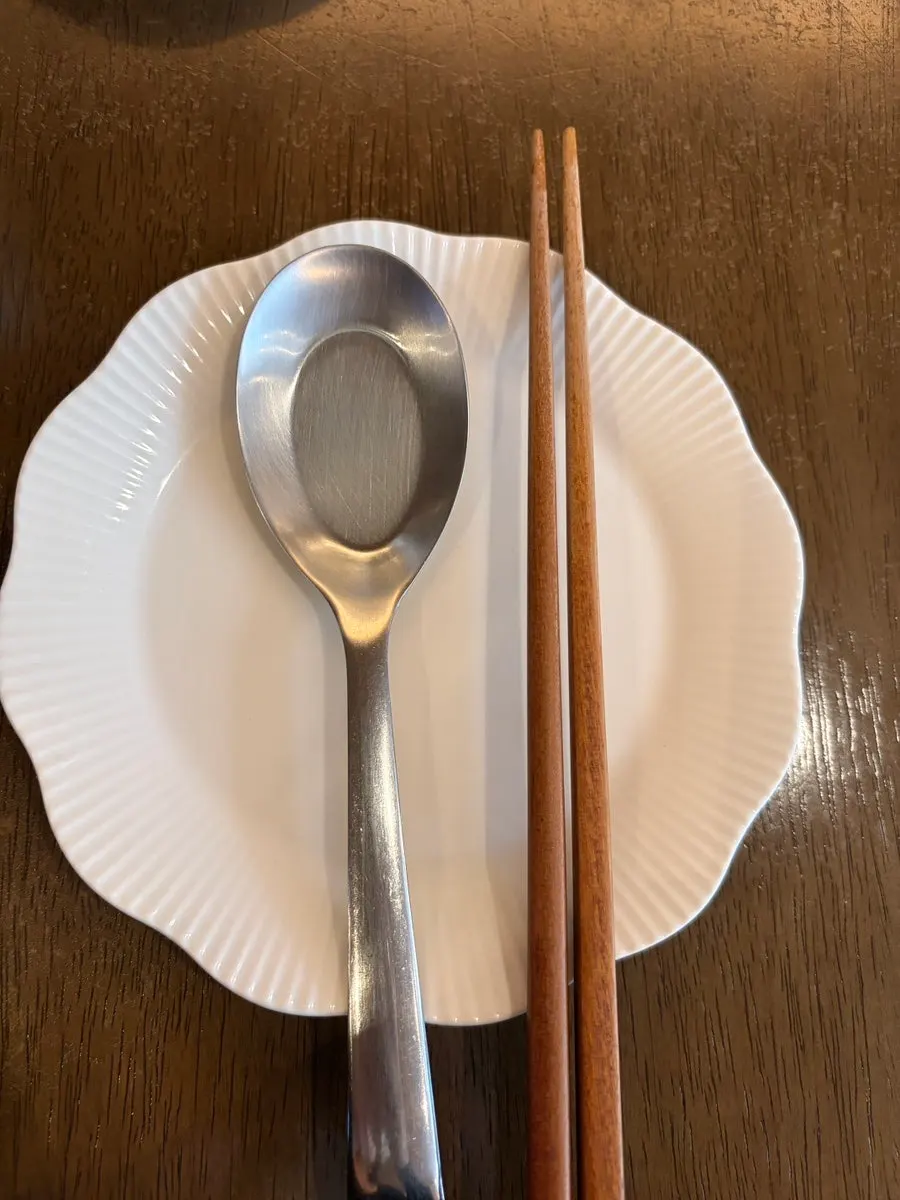 Cabbage pickle and spoon on an adorable little dish