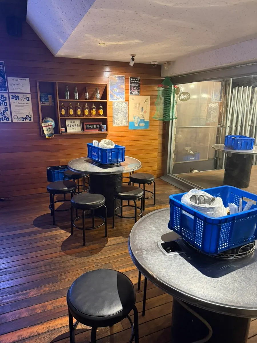 Cozy wood-paneled indoor seating at Nampo