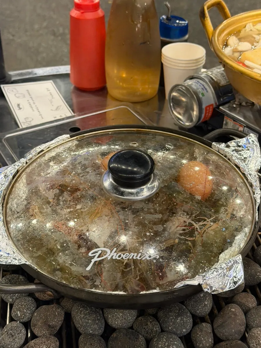 A spread of live salt-grilled raw shrimp before cooking