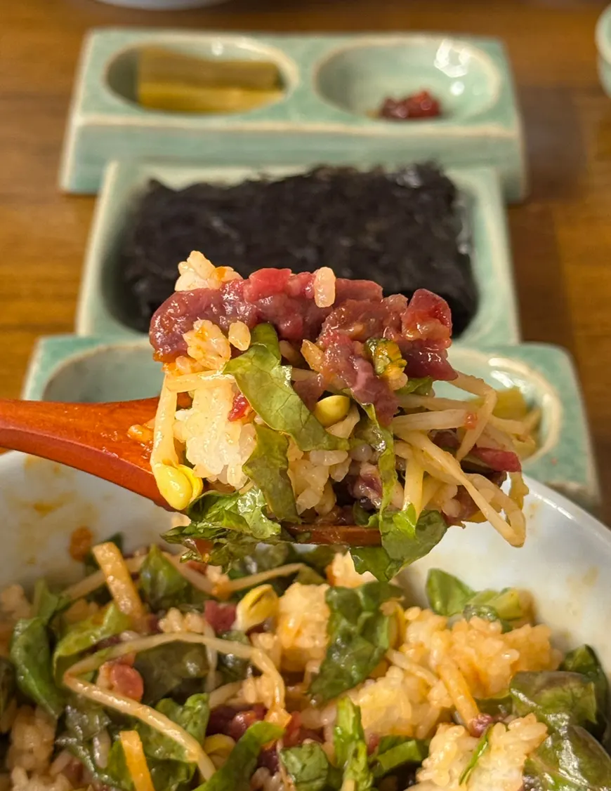 Bibimbap mixed with vegetables and raw beef