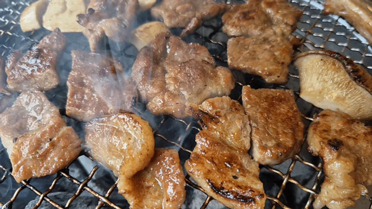 Tender charcoal-grilled pork ribs cooked by the staff
