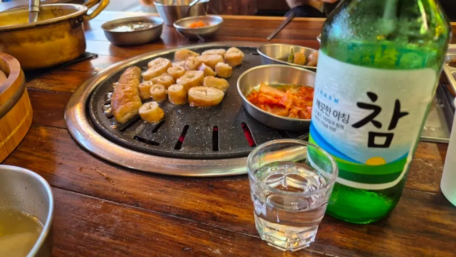 Meat grilled over oak charcoal with side dishes
