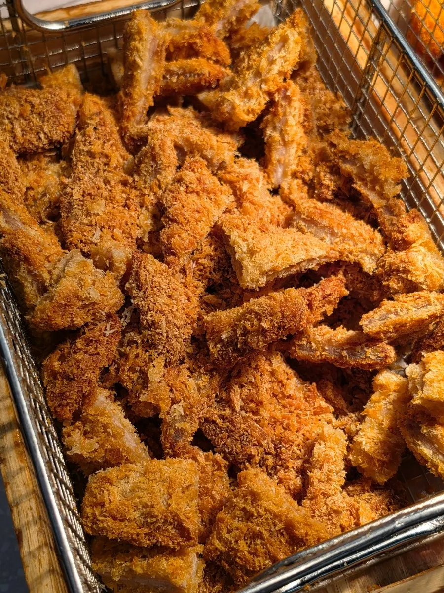 Self-serve bar with fried food and seasoned chicken
