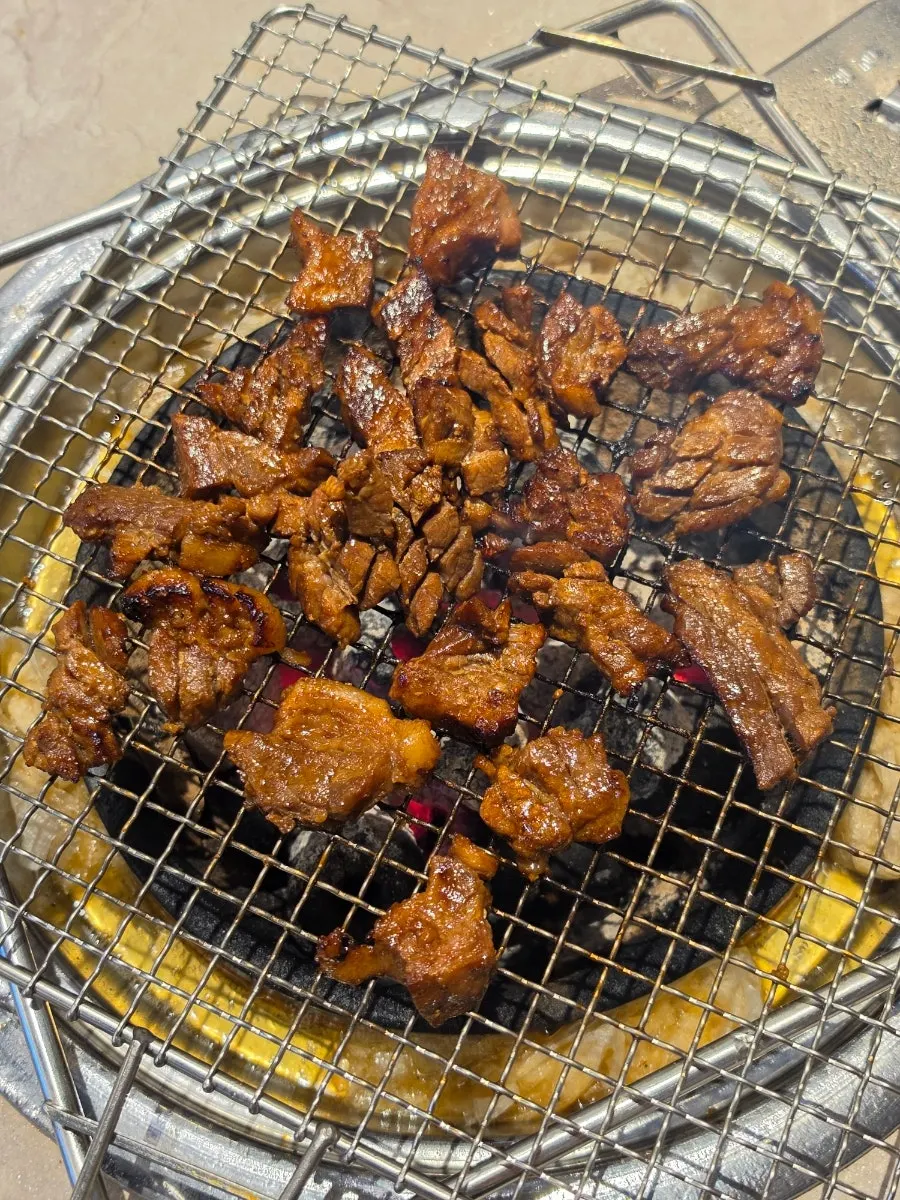 Ribs turning golden-brown on the grill