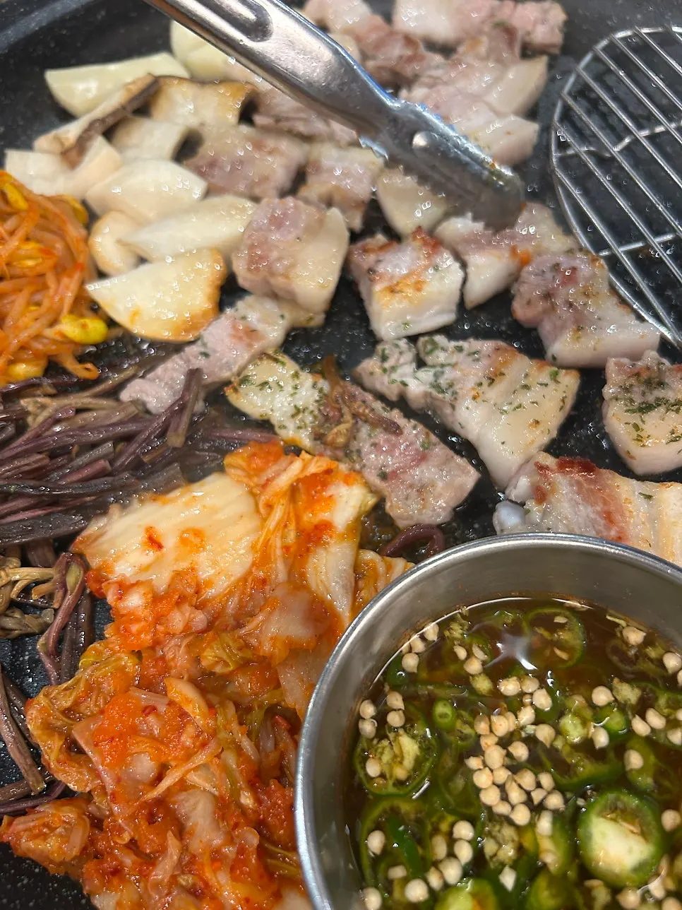 A golden-brown grilled piece of fresh pork belly