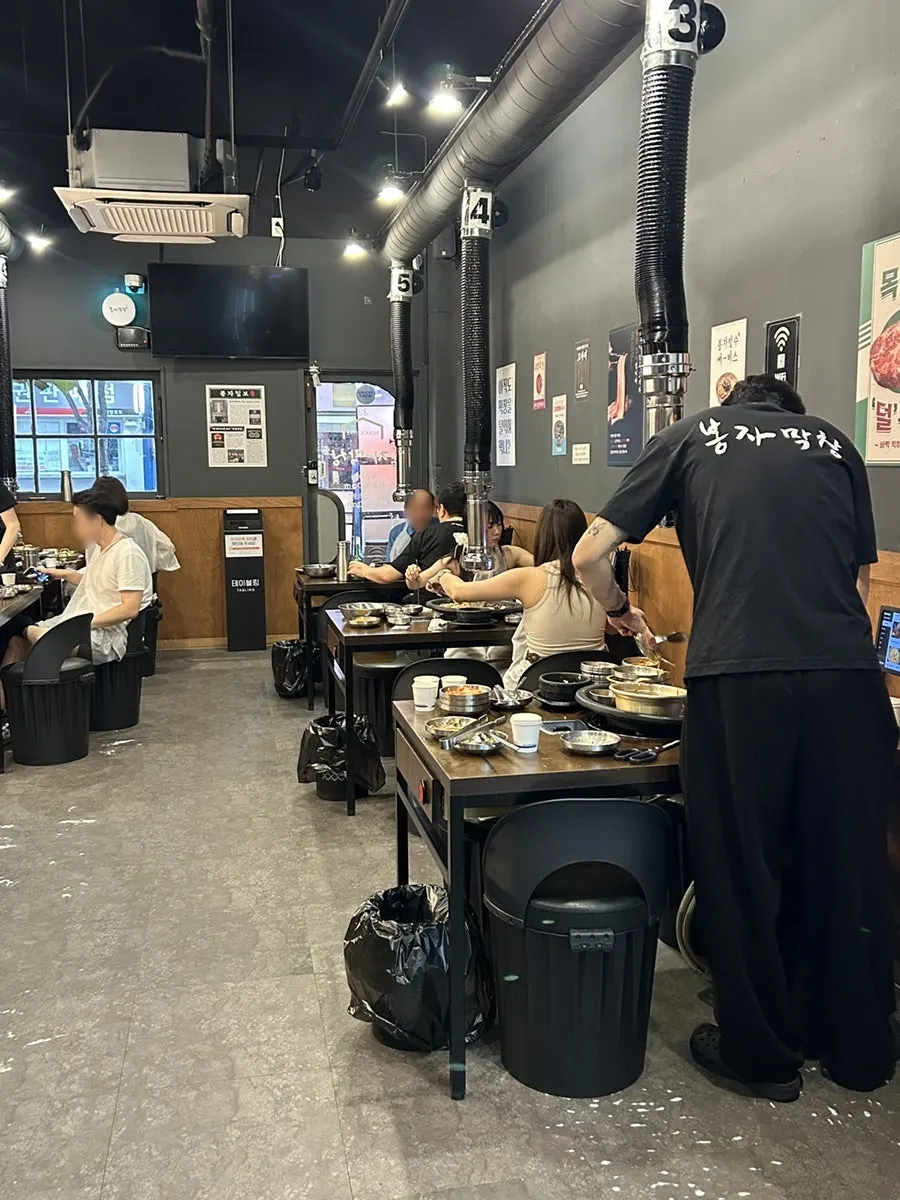 Restaurant interior full of customers on an early weekday evening