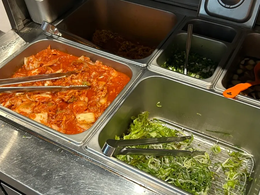 Side dishes and bowls prepared at the self bar