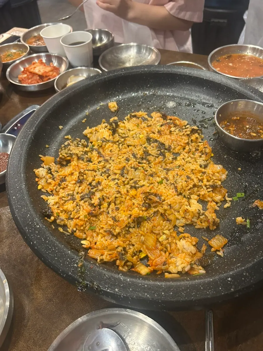 Self-serve fried rice being pressed and fried on the grill