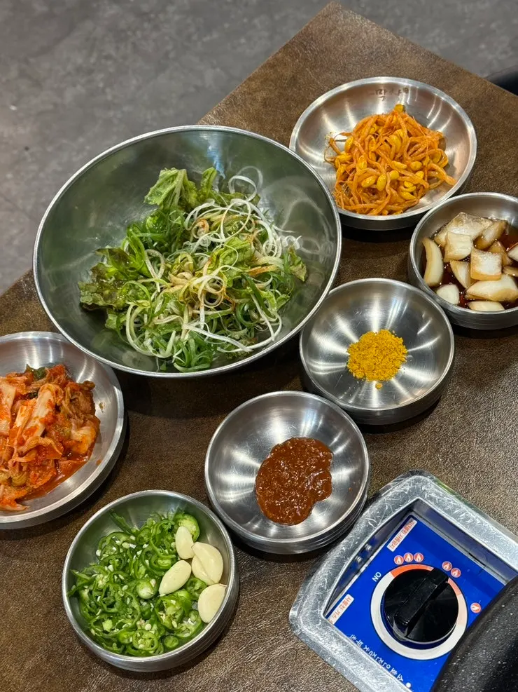 Basic table setting and side dishes at Bongja Makchang