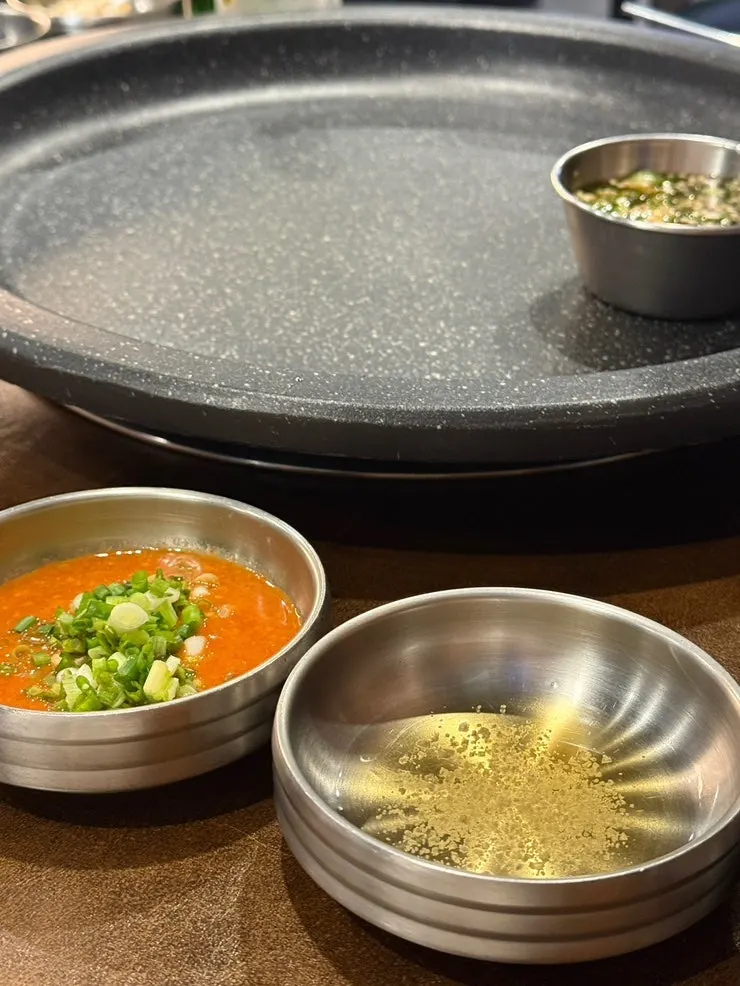 Side dishes including bracken fern, mushrooms, rice cake, and fermented shrimp sauce
