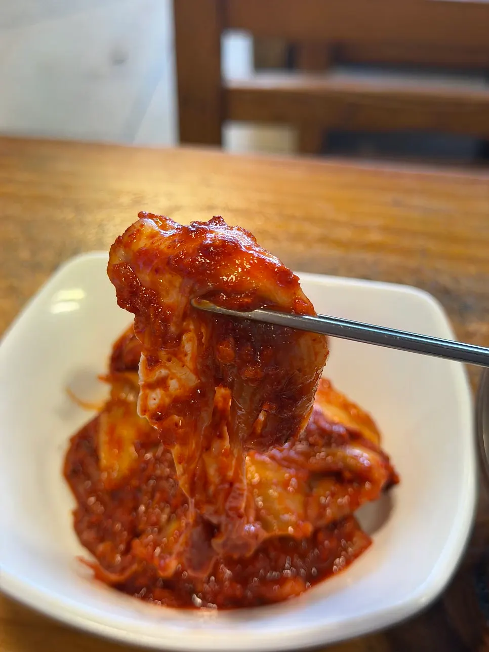 A bite of kkakdugi paired with the gukbap
