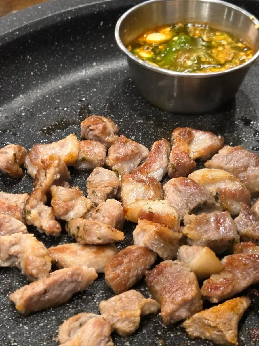 Thick-cut pork neck on the grill