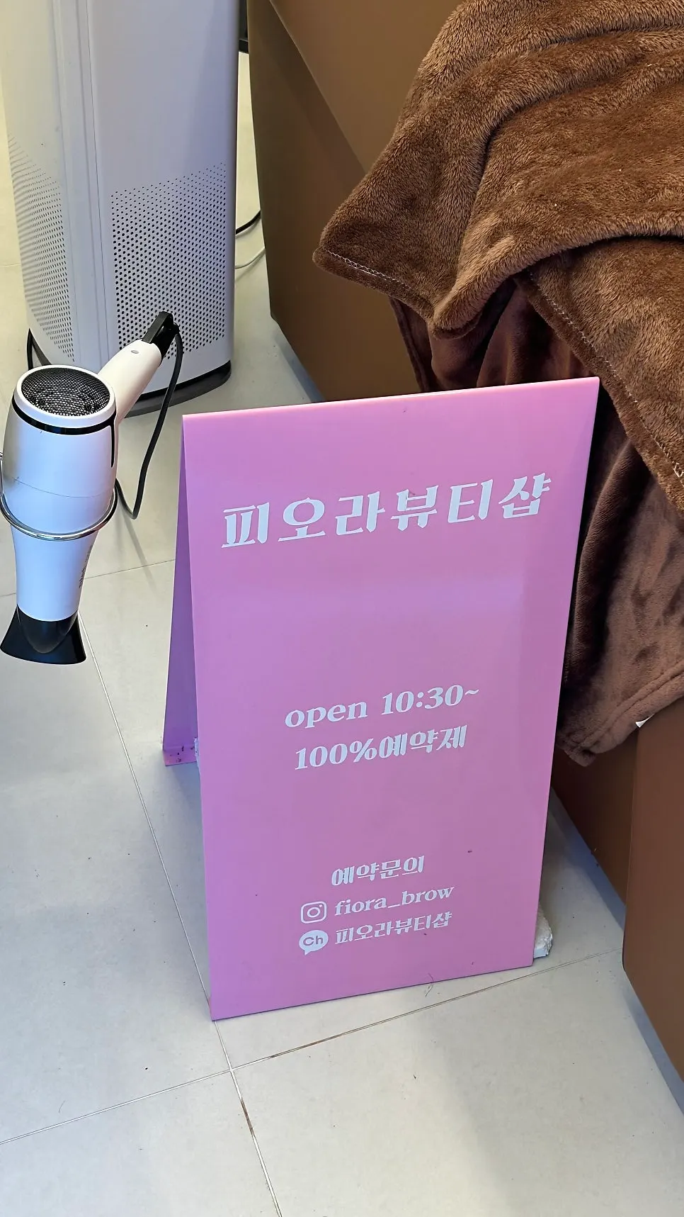 The director's certifications displayed on one side of the shop