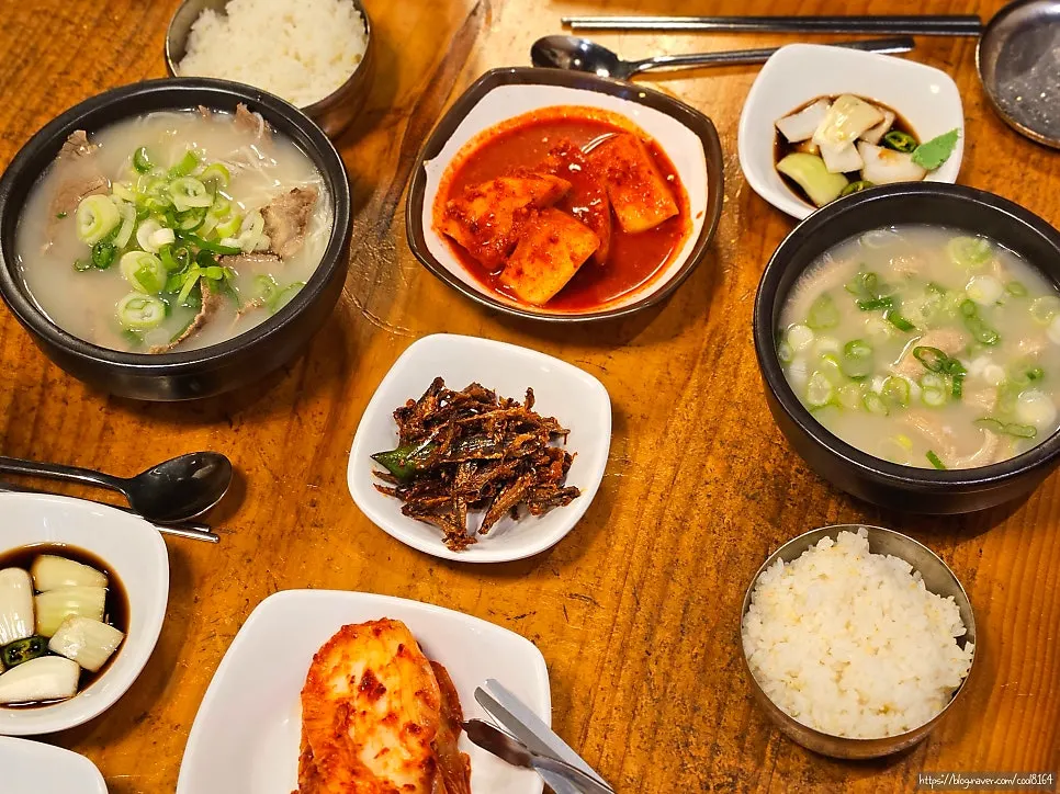 Table set with two bowls of teukseol-nongtang and yangtang