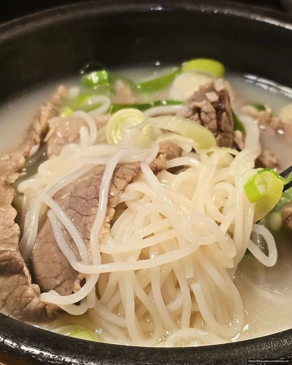 Vertical photo of gukbap and banchan at Hanwoojang