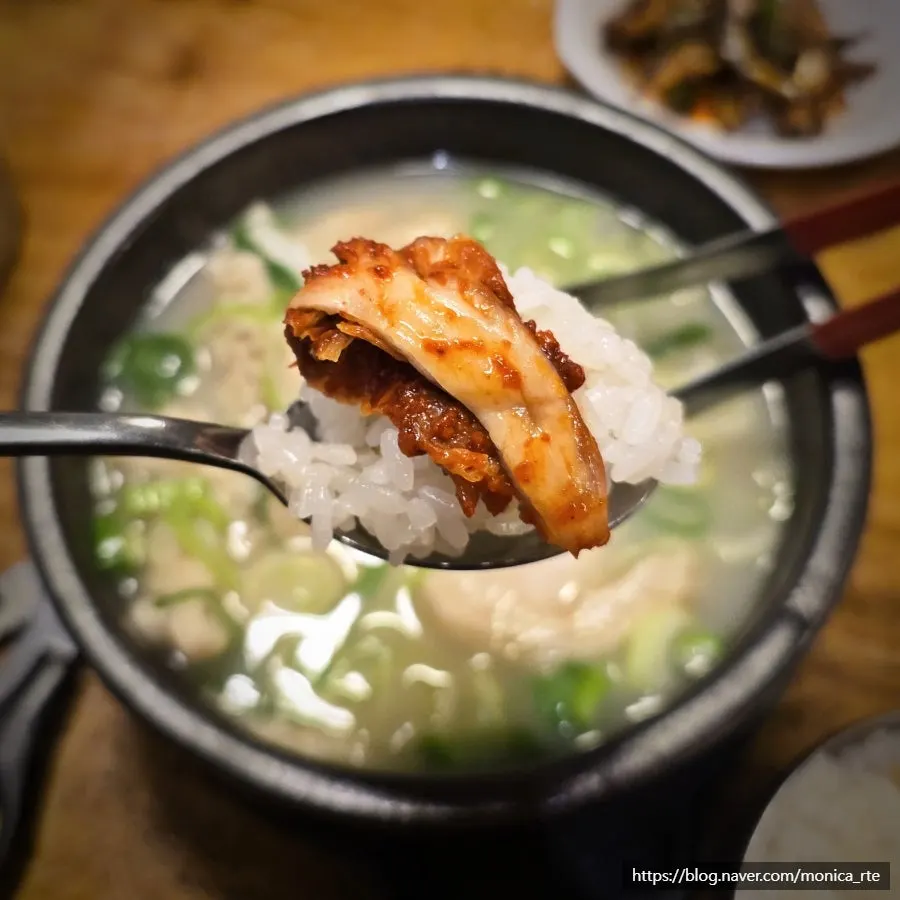 A spoonful of yangtang and rice topped with kimchi