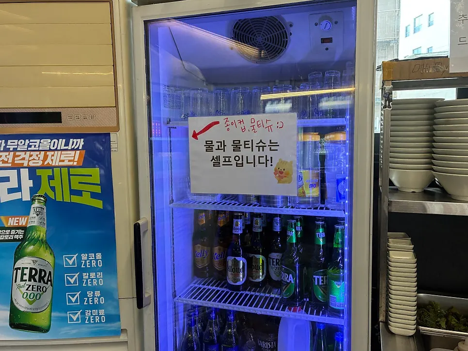 Self-serve water and wet wipe station