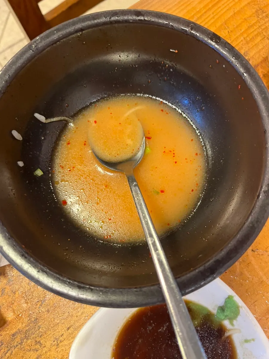 Empty gukbap bowl after finishing with dagadagi added