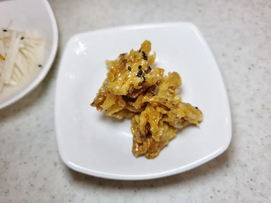 Fried burdock topped with sweet sauce
