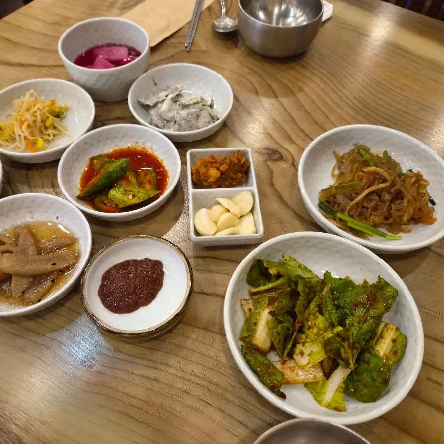 Fresh kimchi and japchae side dishes