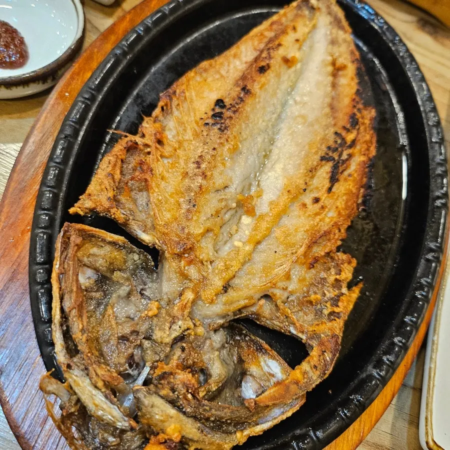 Pork wrap topped with snail ssamjang