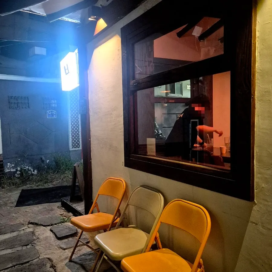 Hanok entrance with warm lighting and decorative objects