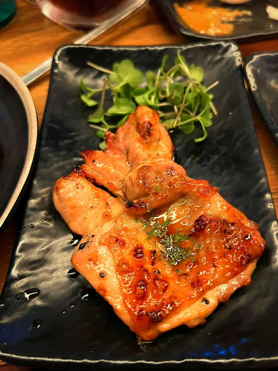 Tsukune served with an egg yolk