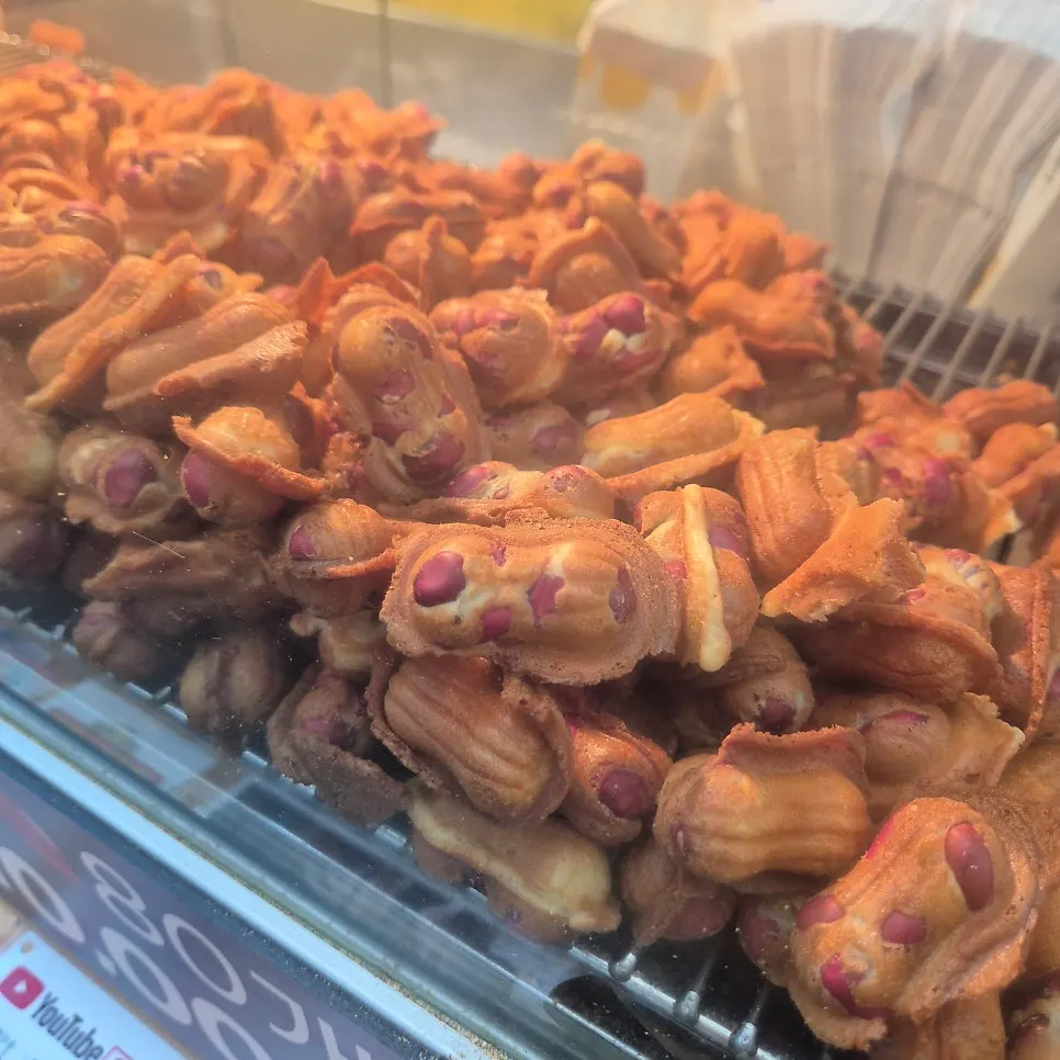 Peanuts being filled into molds for baking