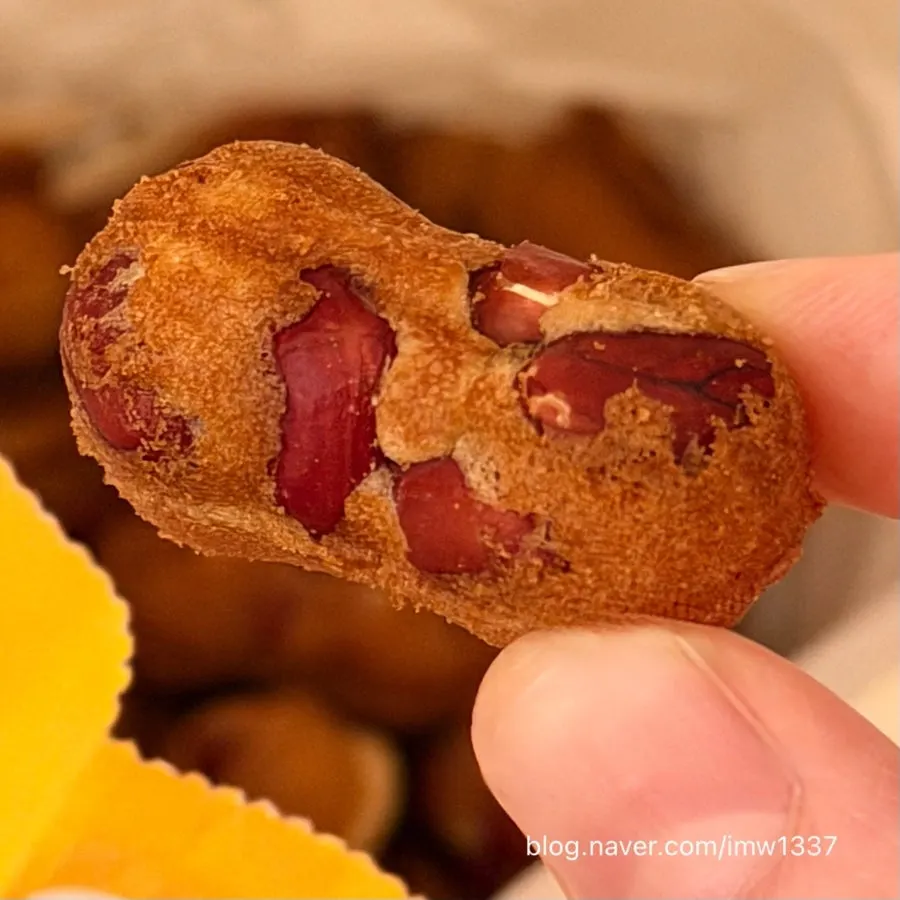 Cross-section of peanut bread packed full of peanuts