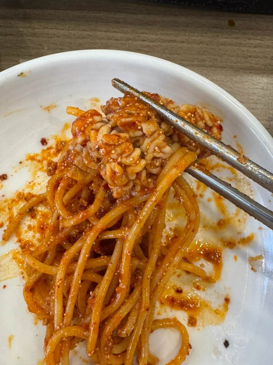 Spaghetti noodles found hidden under the plate