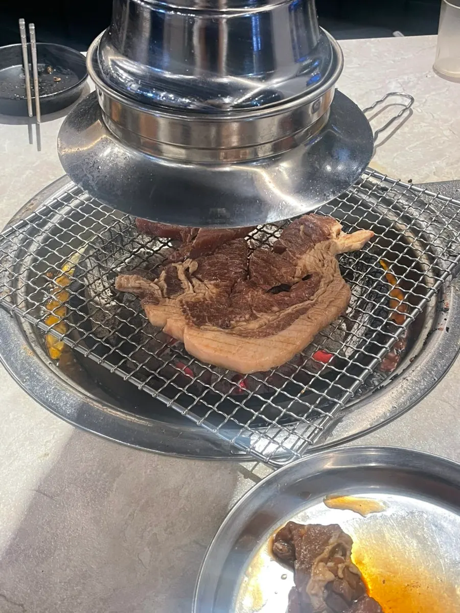 Gankeun Galbi pork ribs grilled on a grate