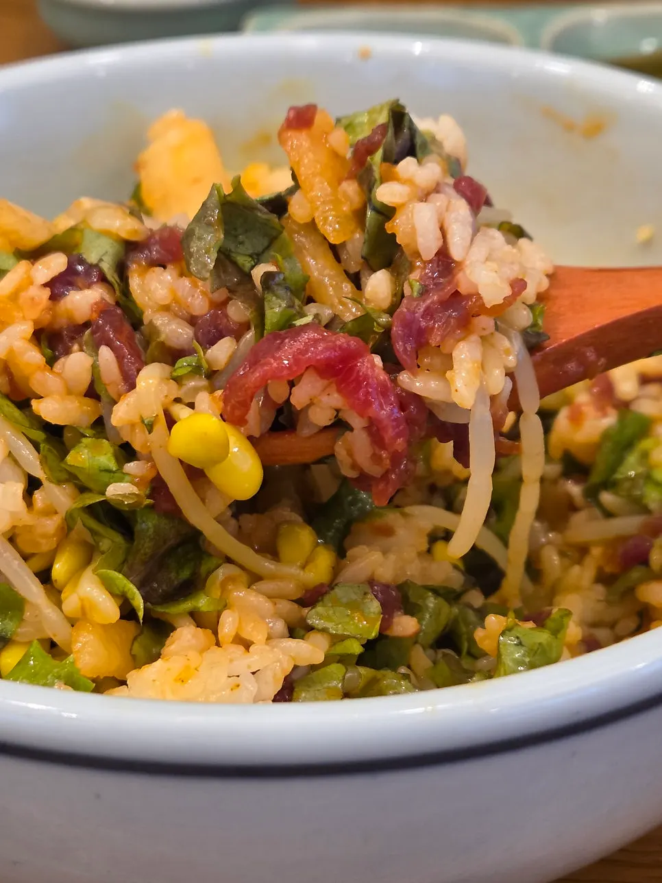 Mixing yukhoe bibimbap after adding egg yolk