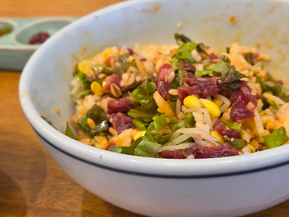 Bibimbap mixed with raw beef and vegetables