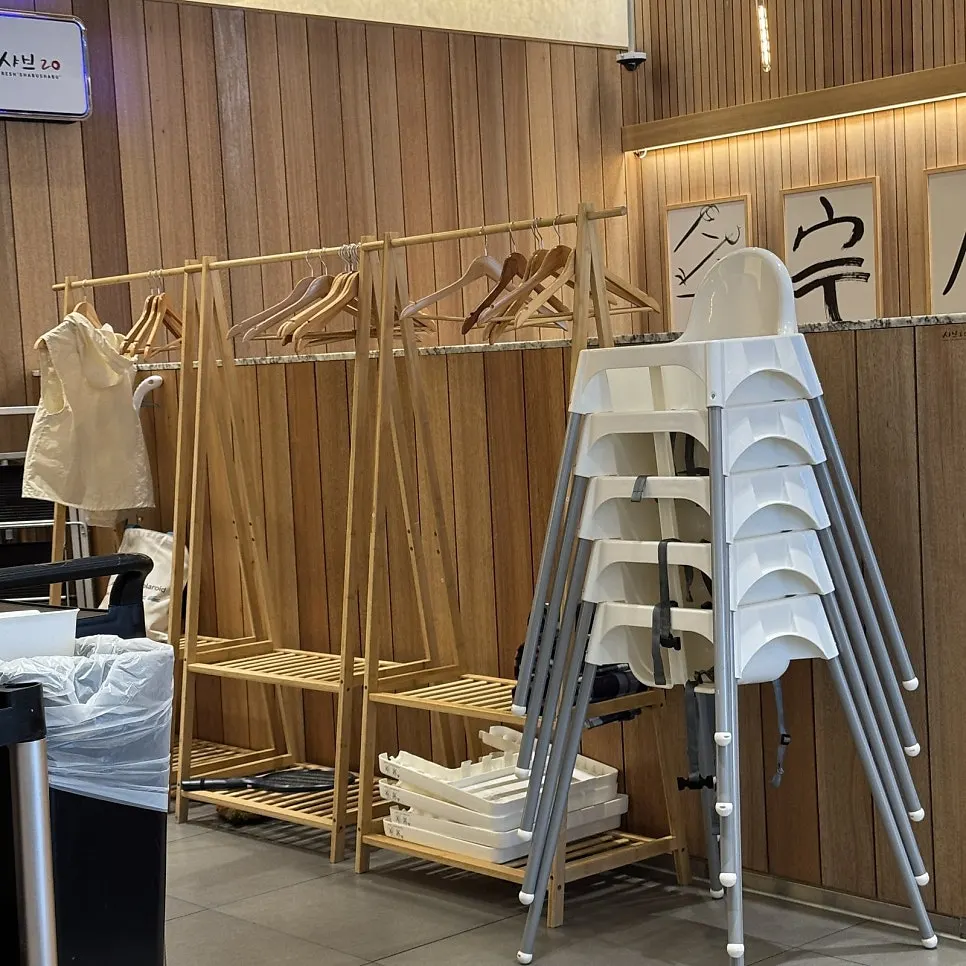 Coat rack and high chair in a corner of the restaurant
