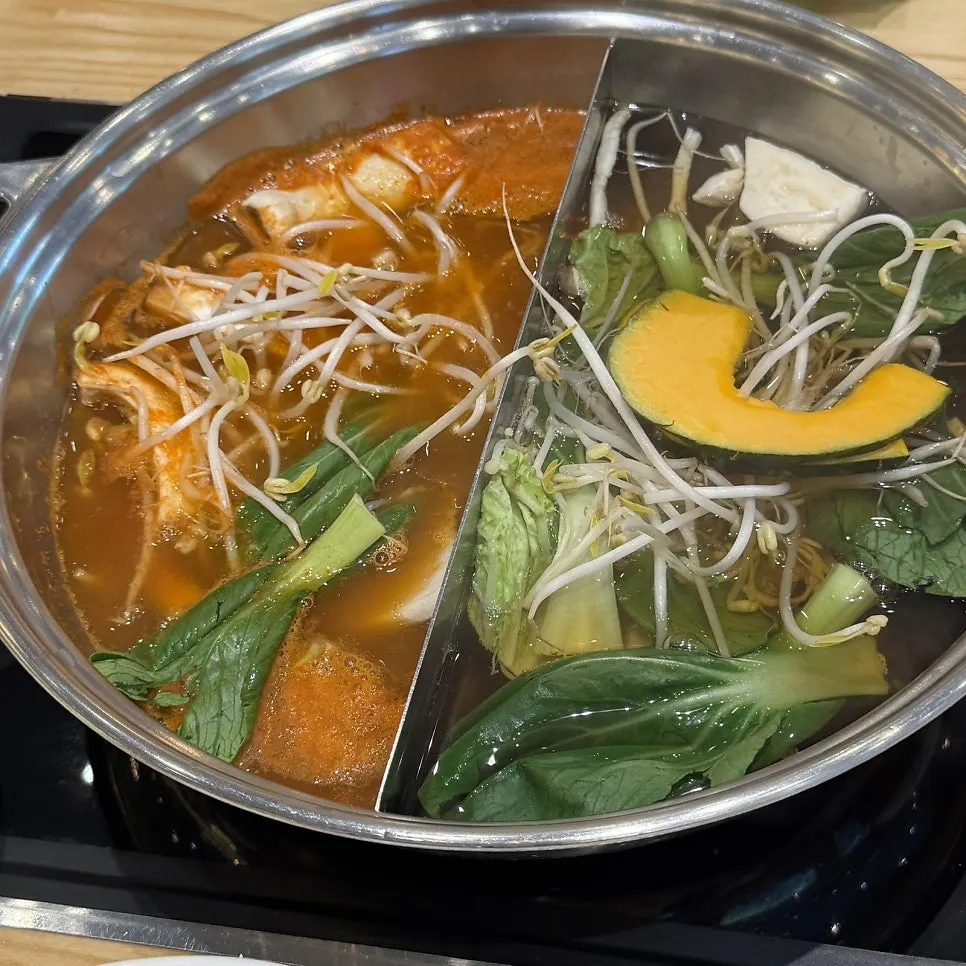 Shabu-shabu with bean sprouts and cabbage in spicy broth