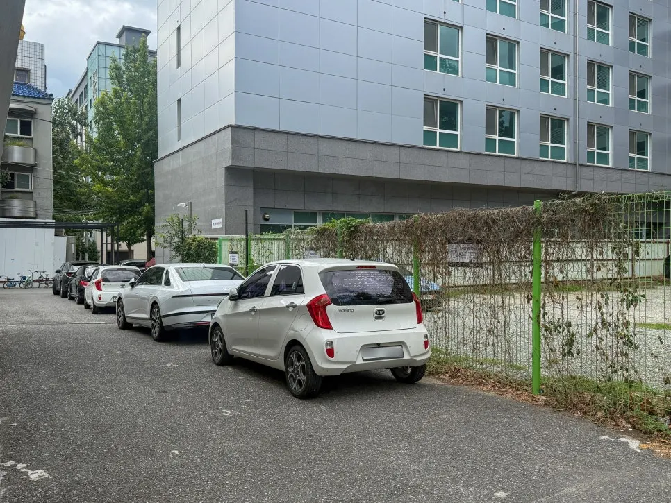 Entrance to Baut, a white building with a blue door as its accent