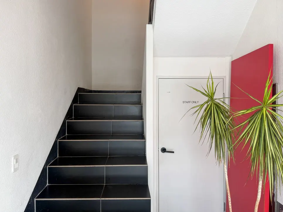 Staircase leading up to Baut's second and third floors