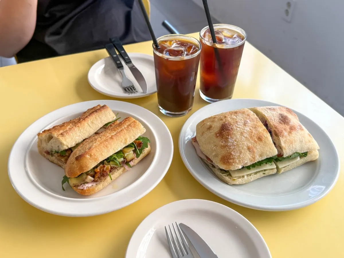 Brunch spread with sandwiches and an Americano together