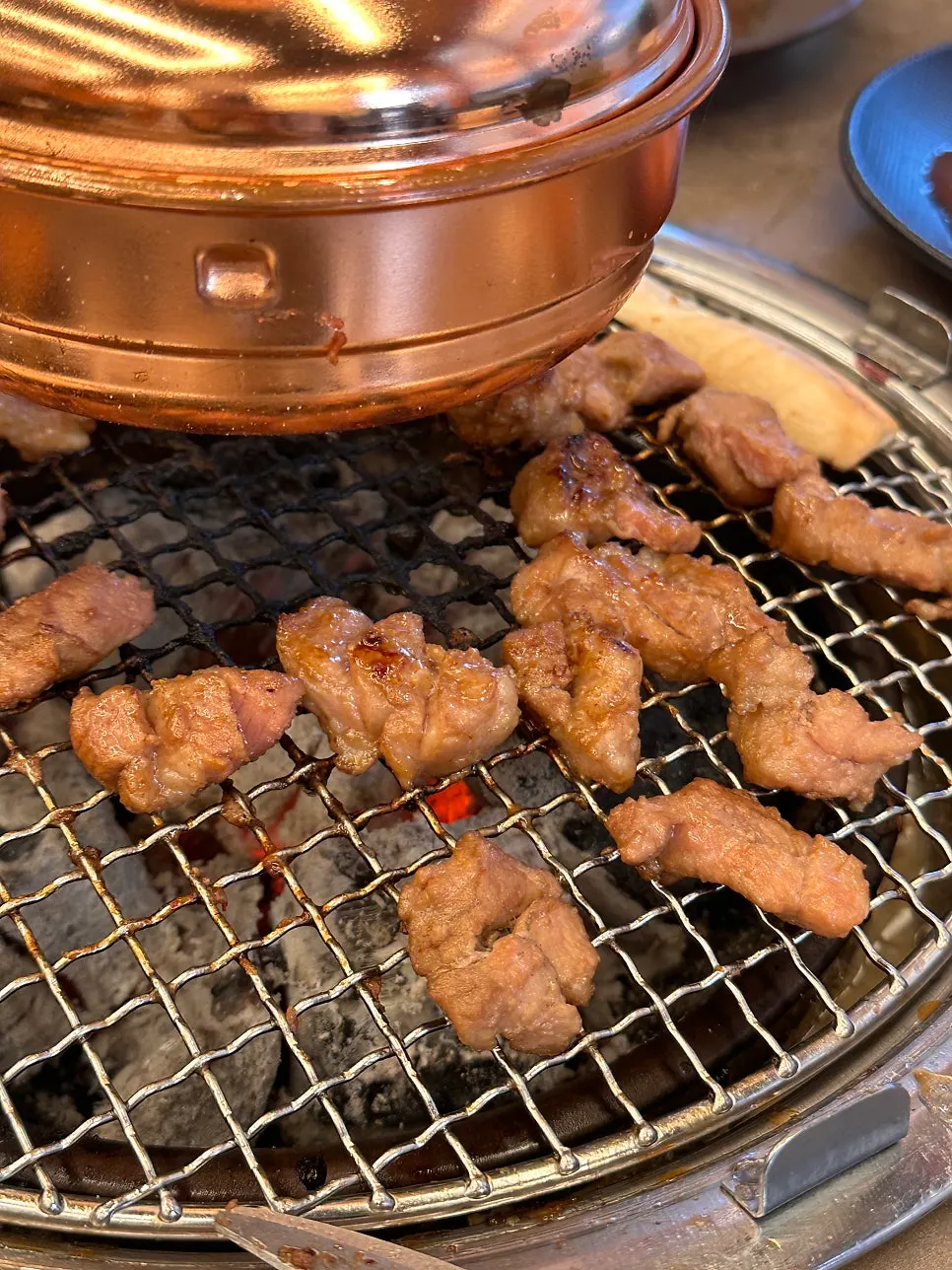 Marinated galbi cooking on the charcoal grill plate