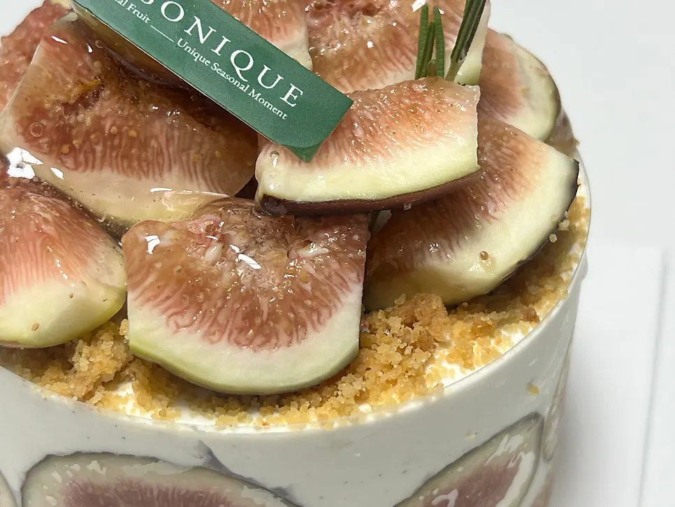 Fig cake with birthday candles lit