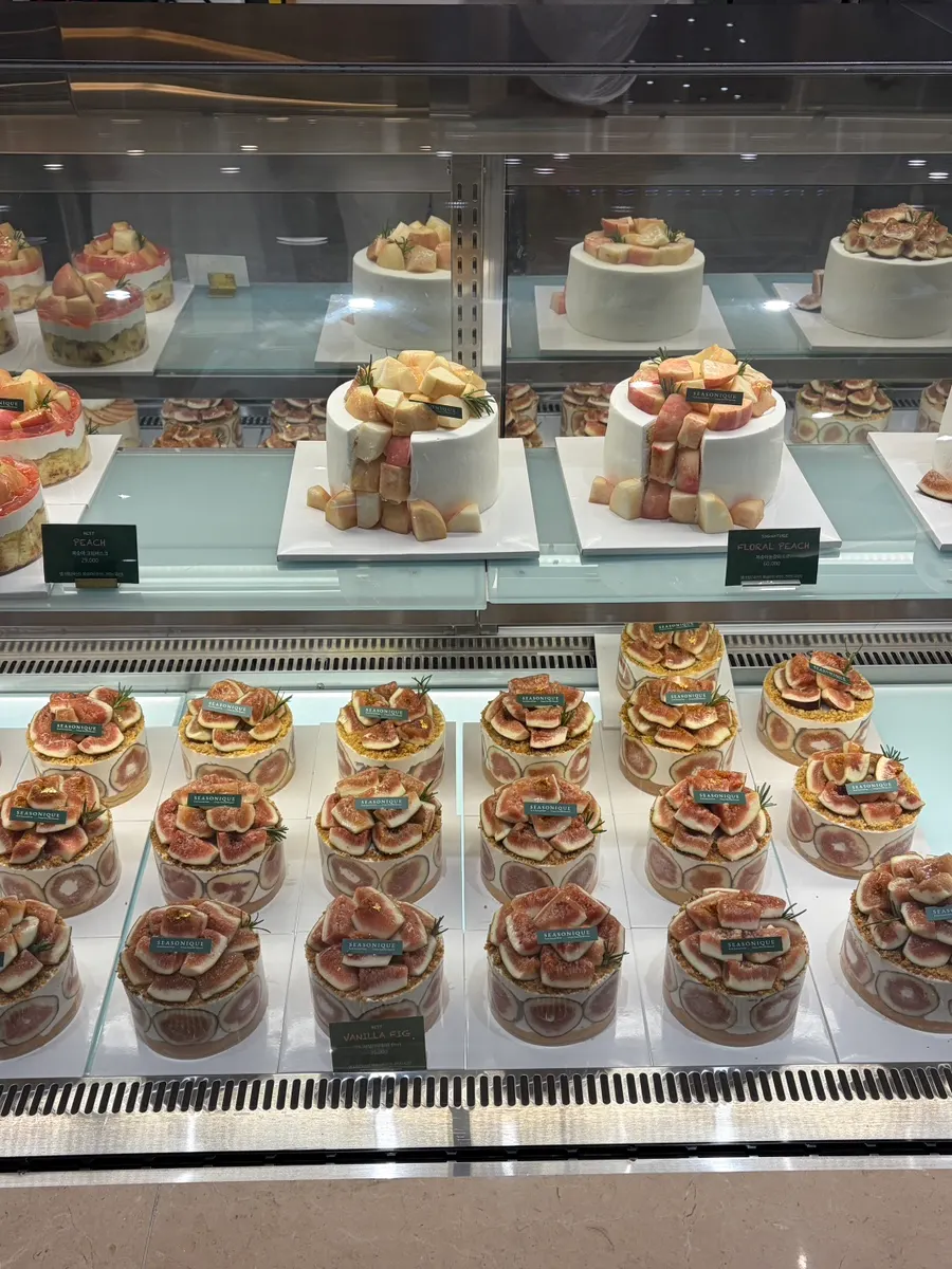 Peach cakes on display at Siznique