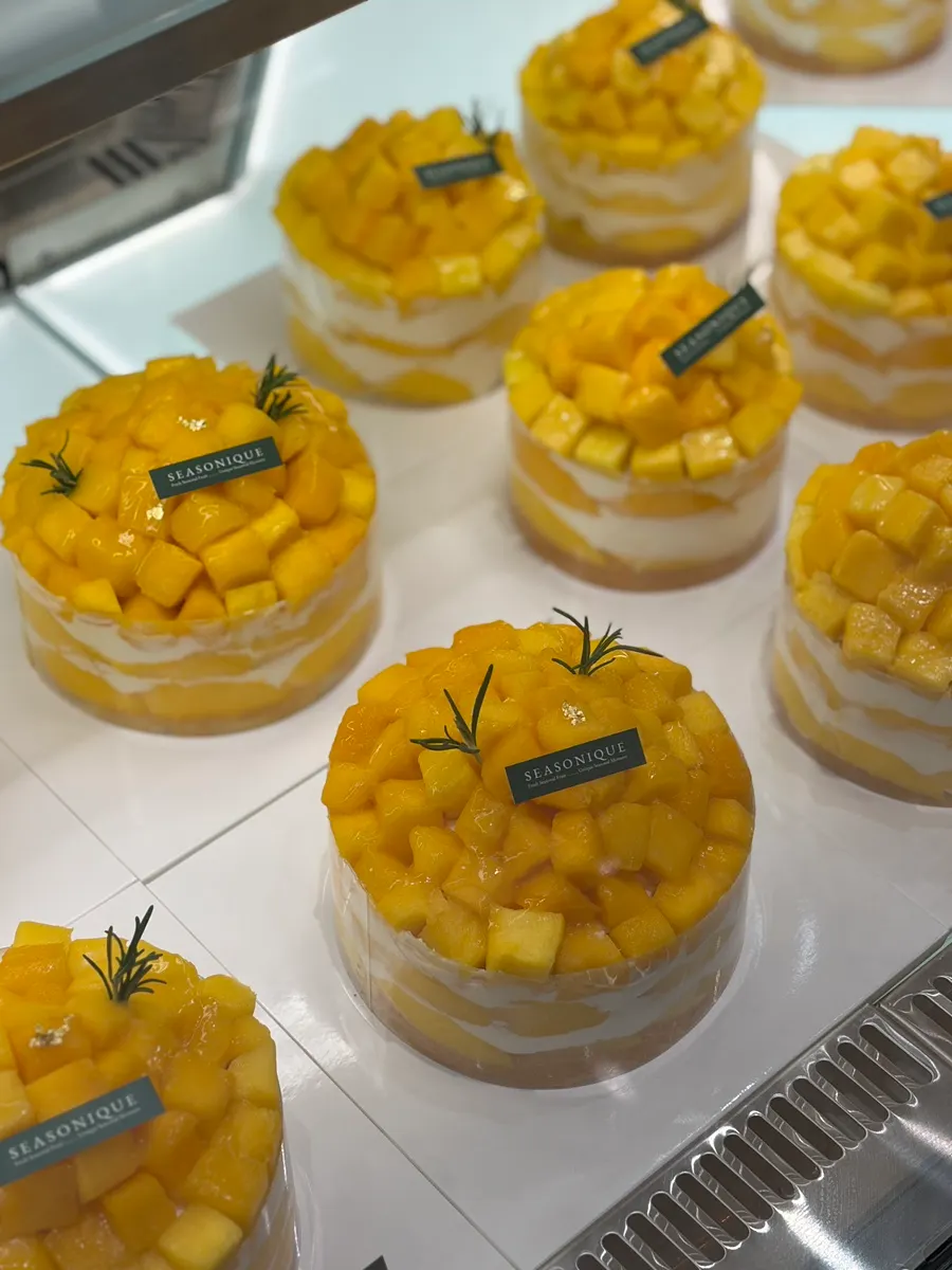 Fruit piled generously on top of a Warreu cake