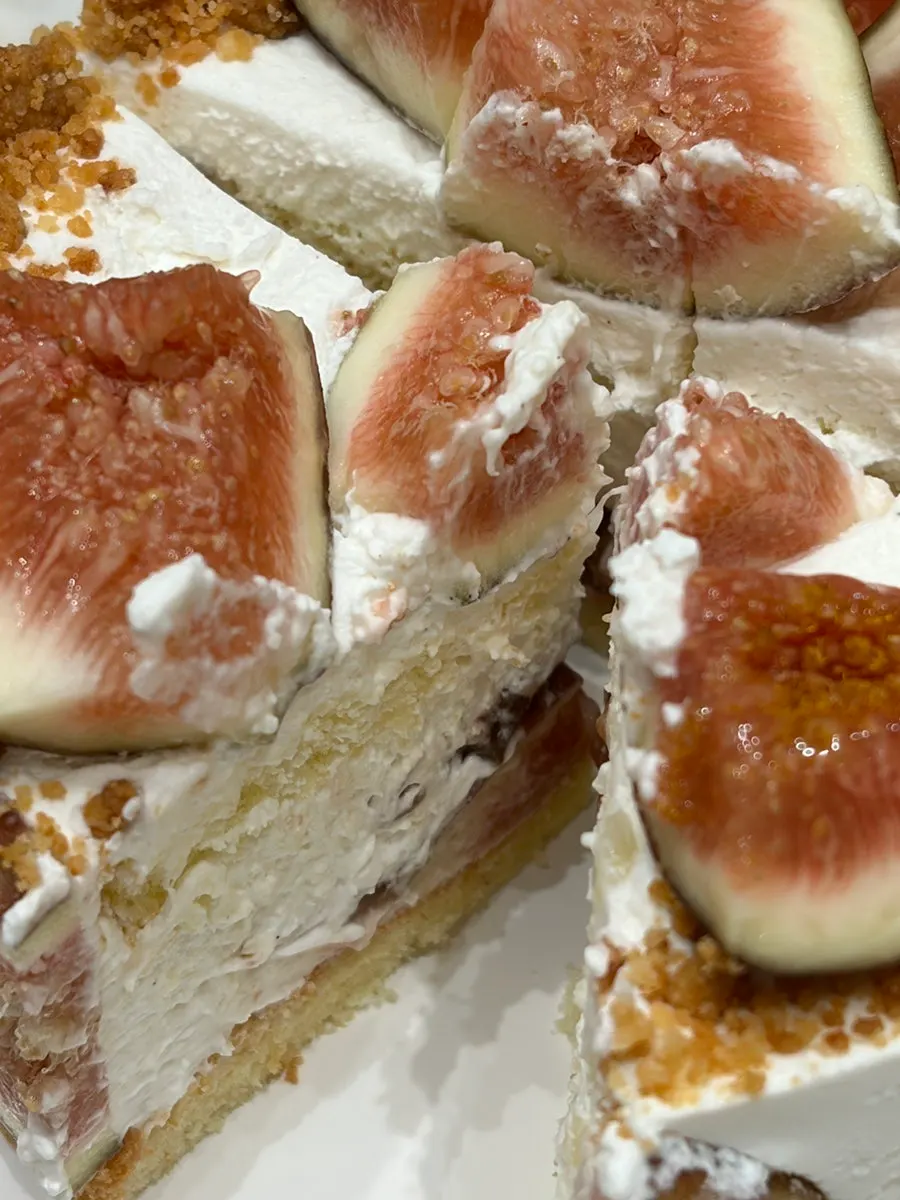 Honey vanilla fig cake topped with crumble and gold flakes