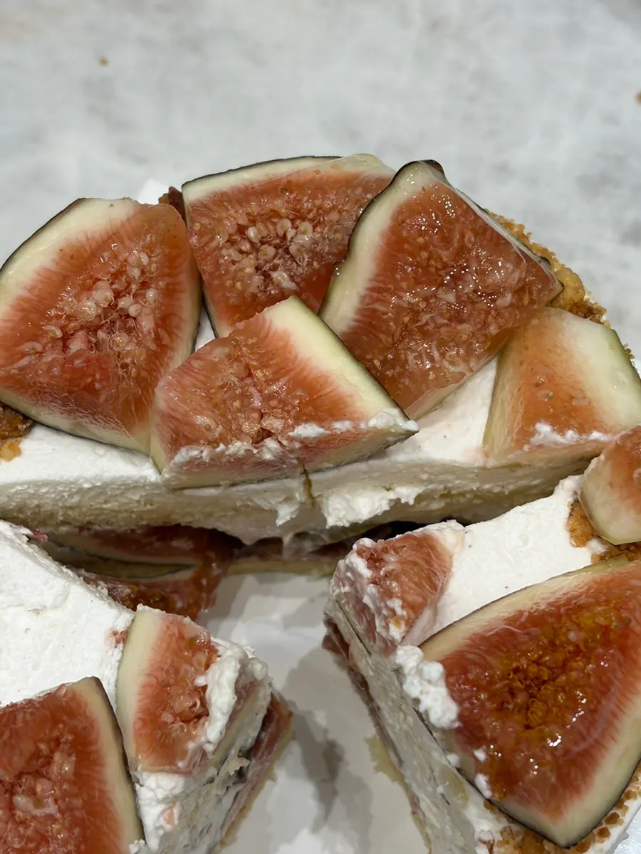 Close-up of fresh fig on top of the cake