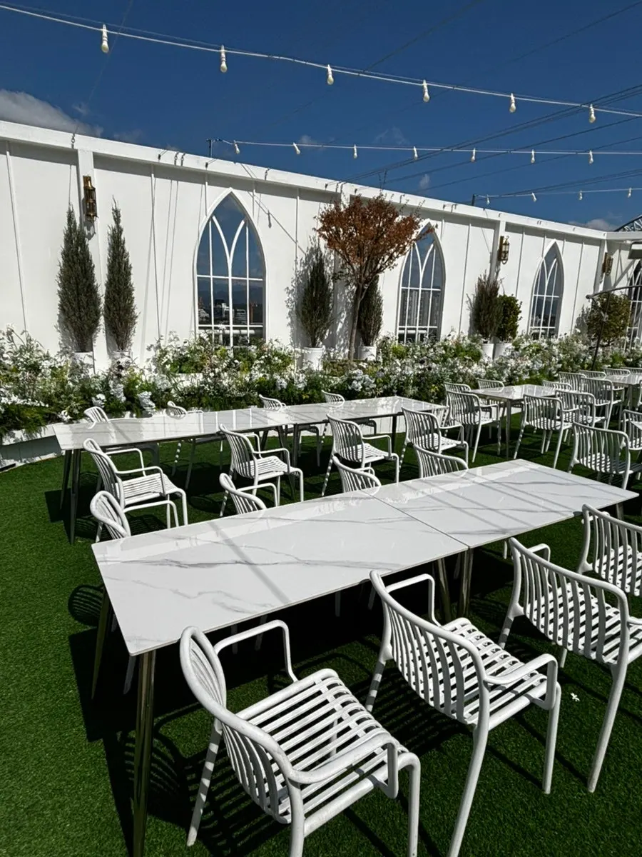 Outdoor hall aisle decorated with flowers and plants