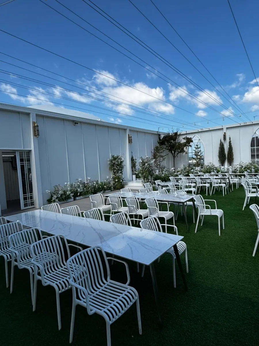 3rd-floor outdoor wedding hall with green scenery backdrop