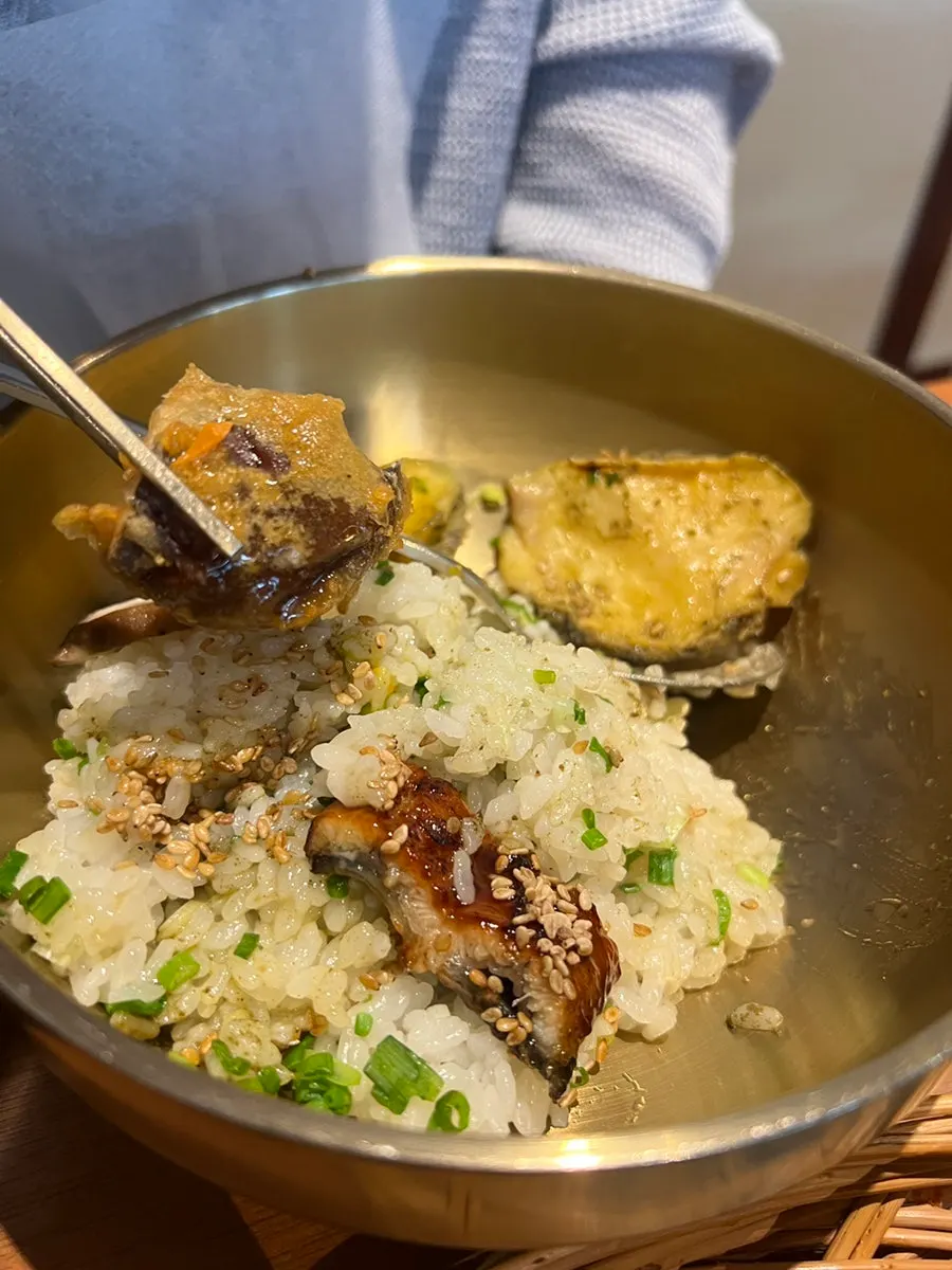 Pot filled with water after the rice has been scooped out