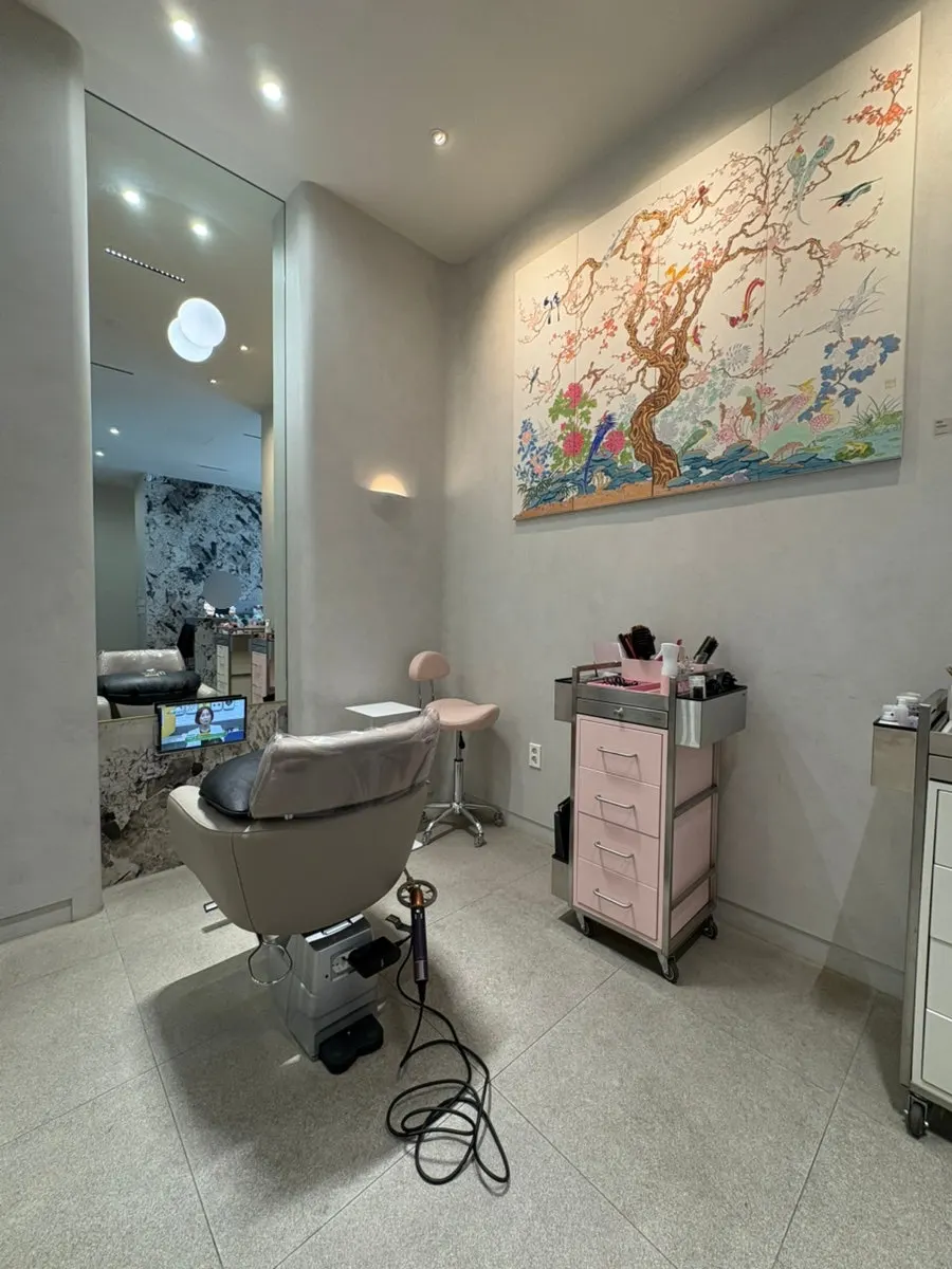 Salon interior with Korean-style framed pieces